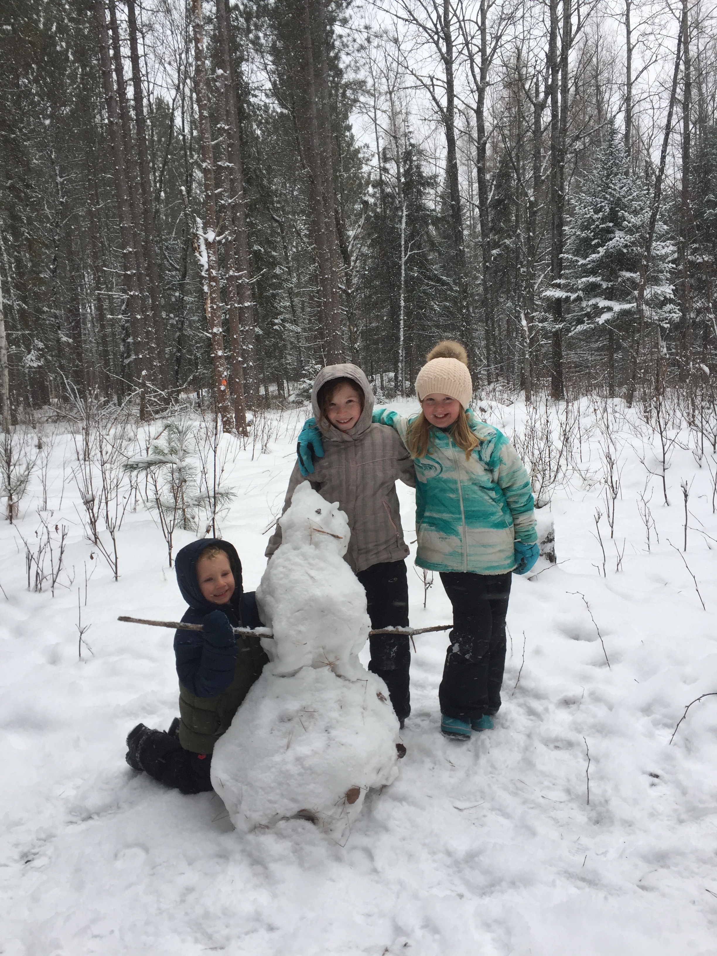 Kids Outdoors in Snow with Snowman